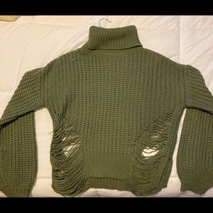 Dark green distressed turtleneck.